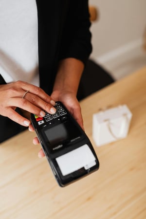 payment-terminal-womans-hand-typing